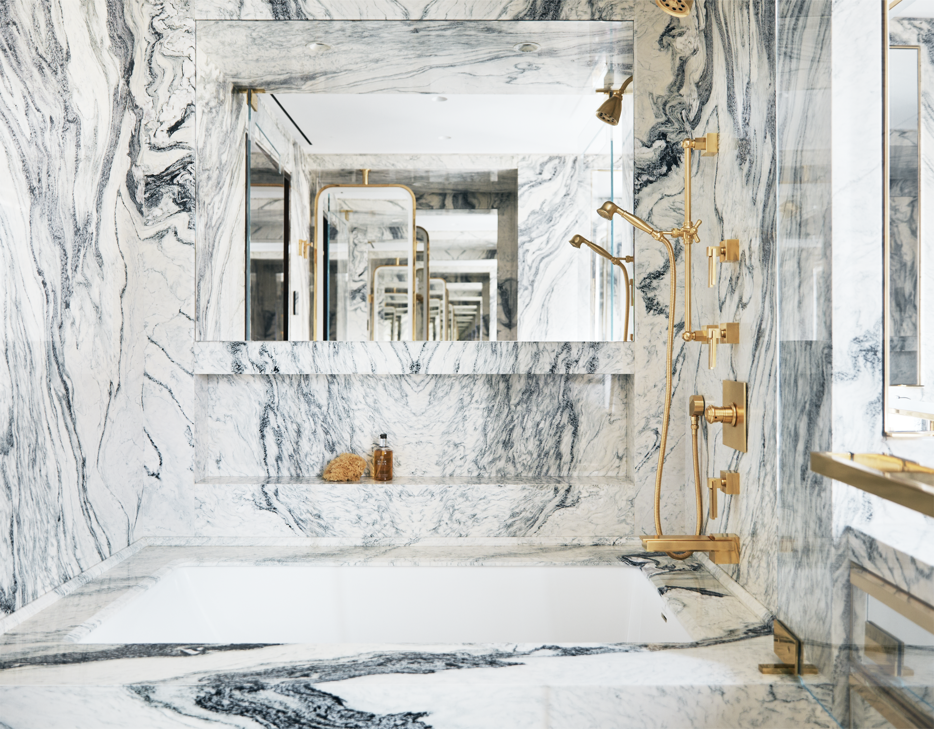 Luxe marble bathroom and tub by Pembrooke & Ives.