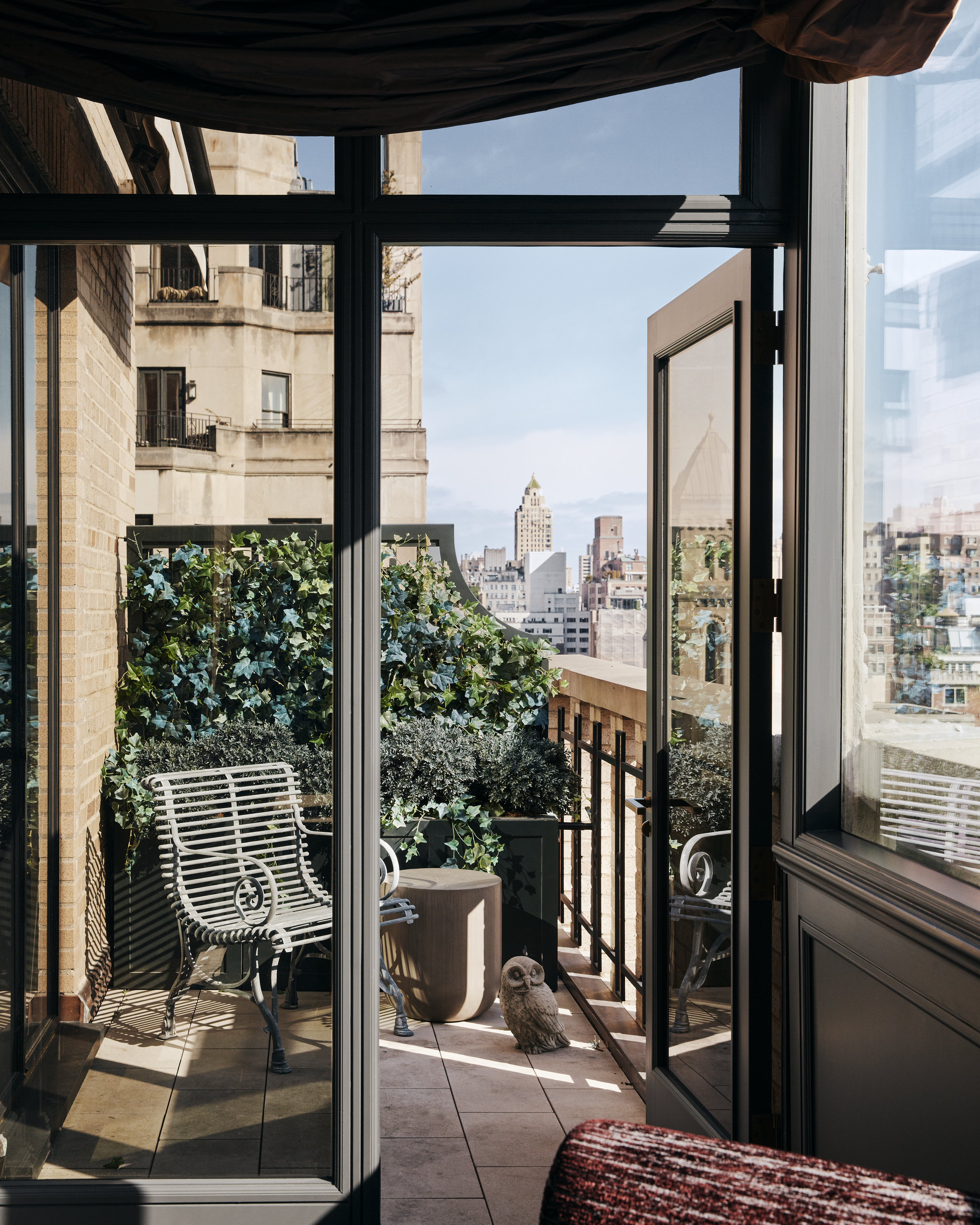 New York City interior design by Pembrooke & Ives. Balcony with outdoor seating.