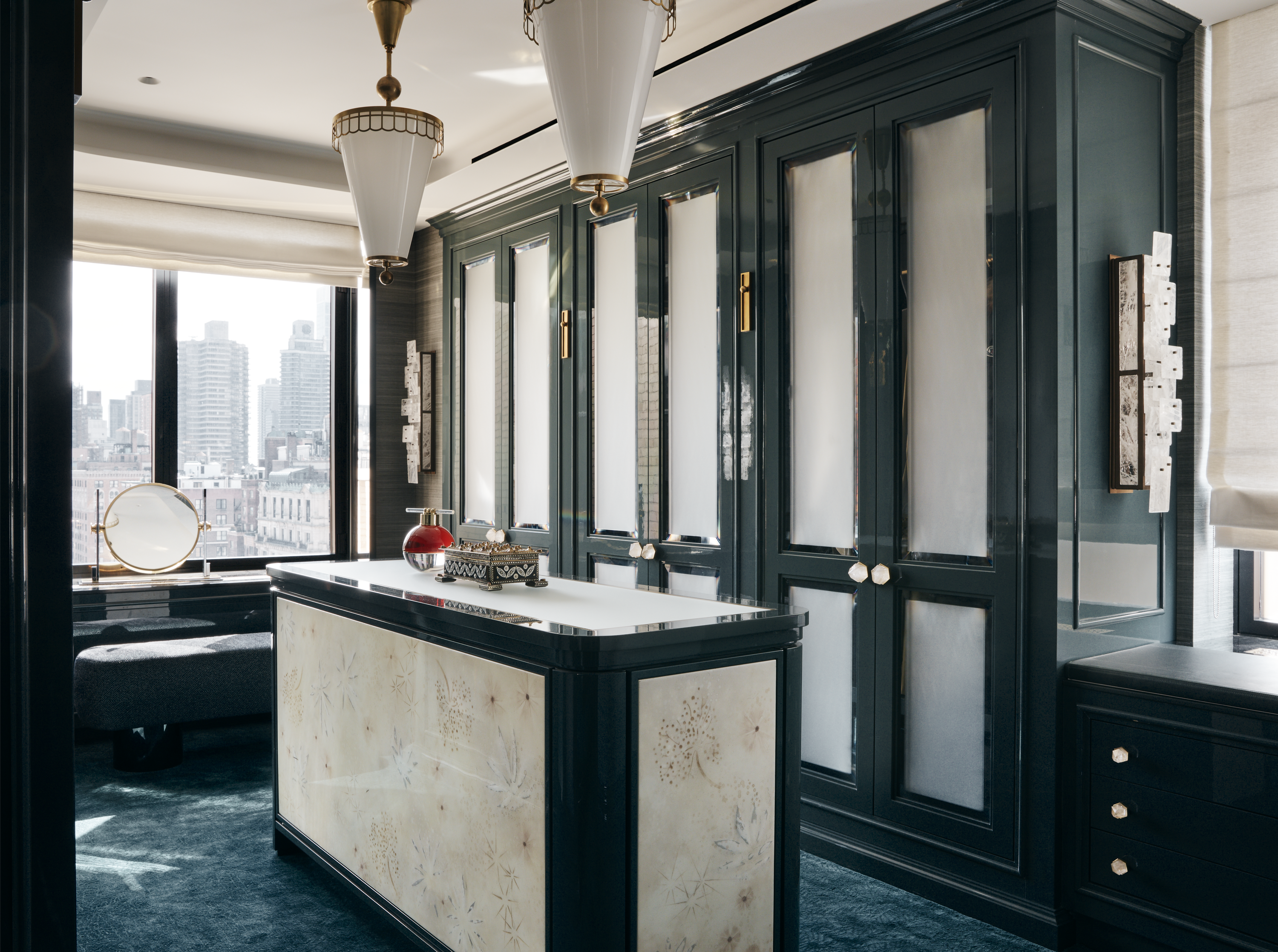 New York City interior design by Pembrooke & Ives. Primary bedroom closet with boutique style dressing...