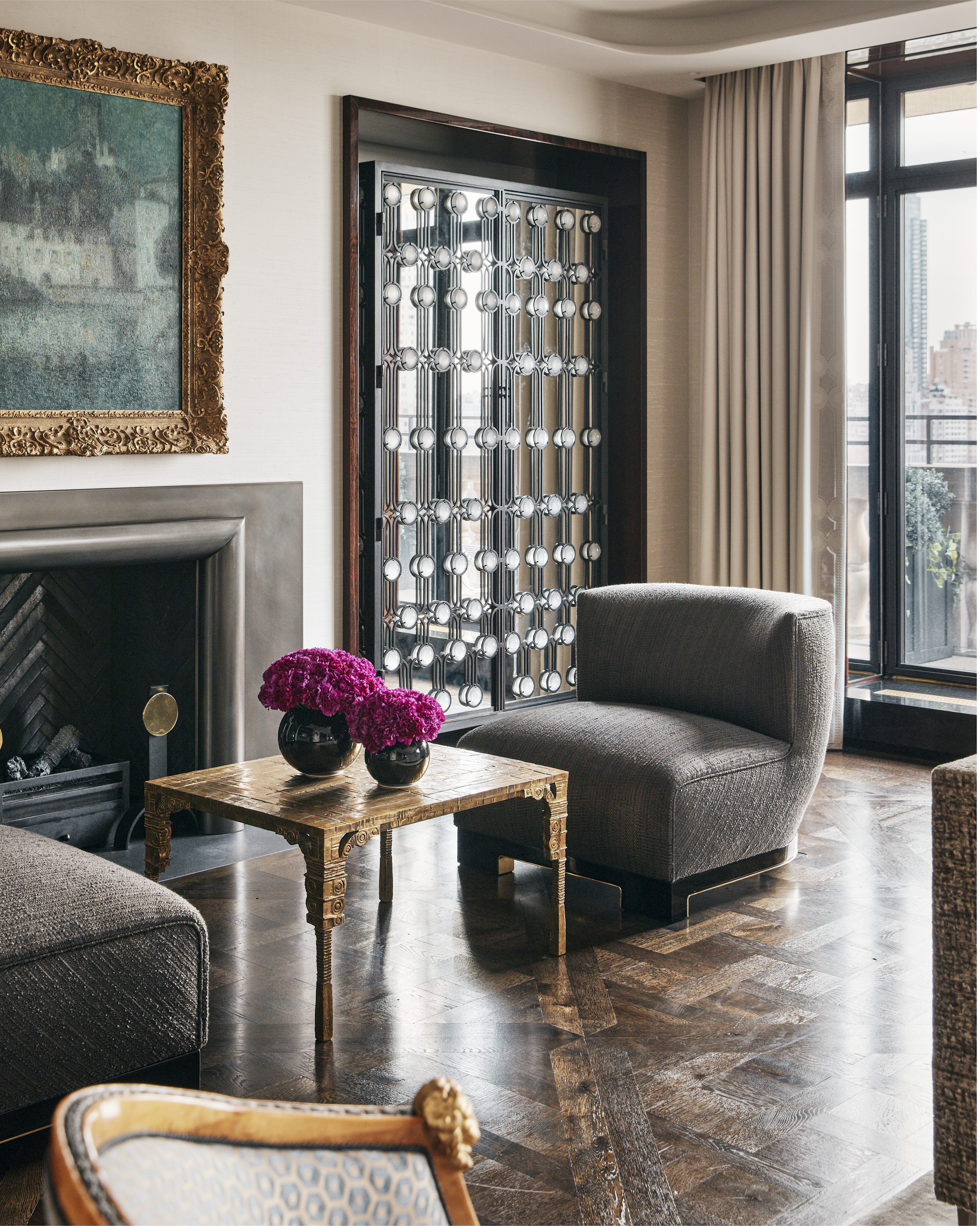 New York City interior design by Pembrooke & Ives. Luxe living room with contemporary and antique...
