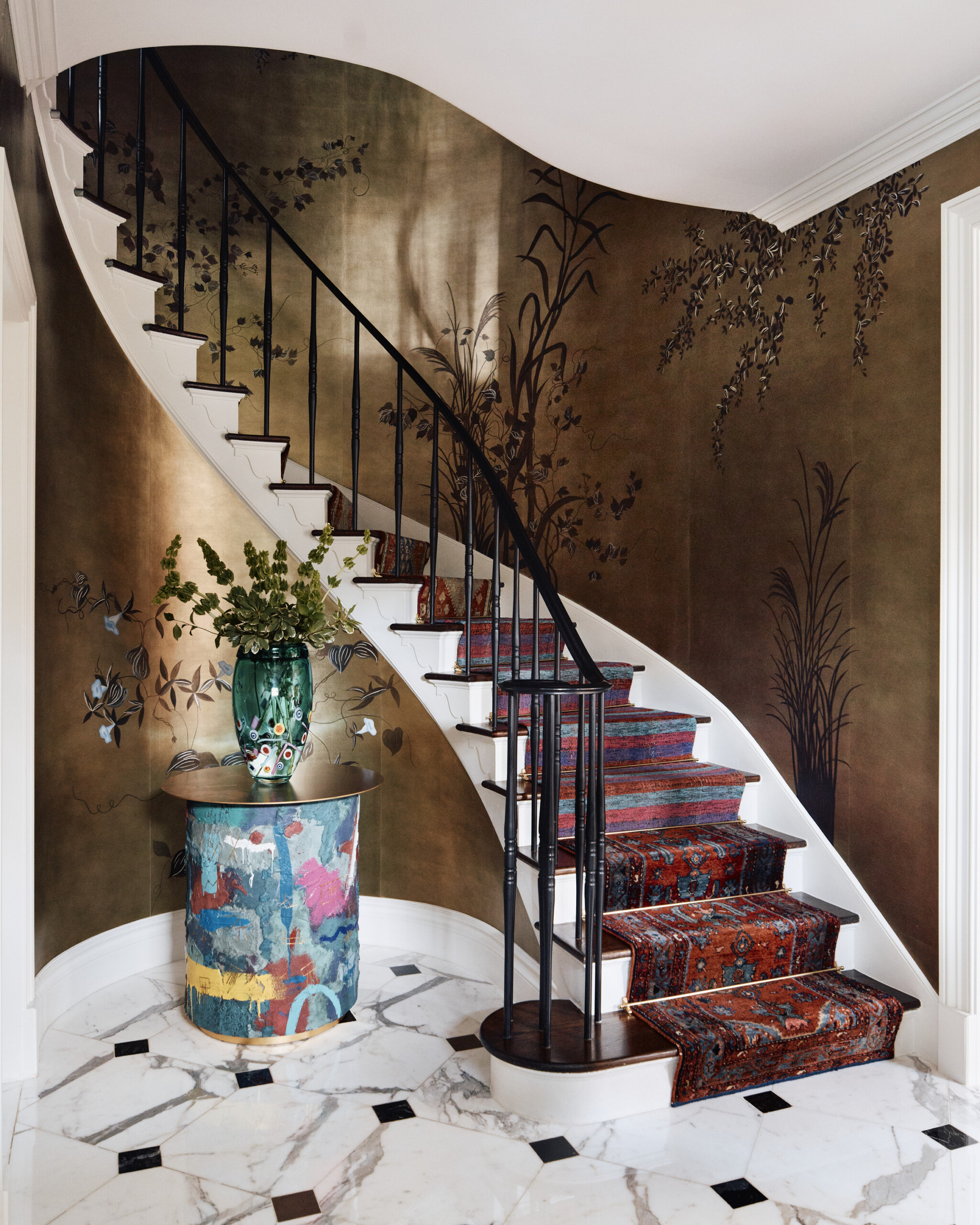 Palm Beach Interior Design by Pembrooke & Ives. Entryway Staircase with gold wallpaper, crown molding,...