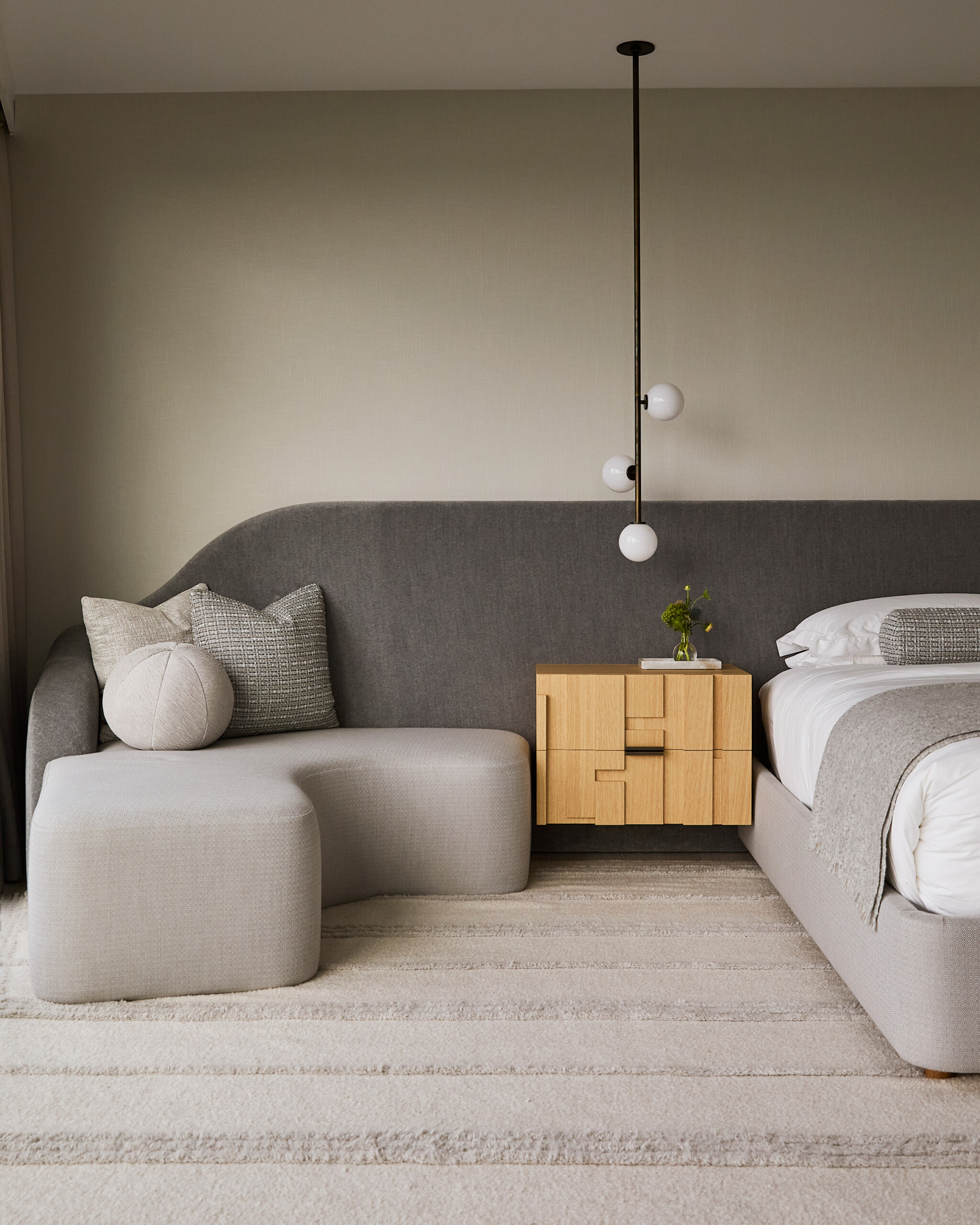 Hamptons Interior Design by Pembrooke & Ives. Primary bedroom with neutral gray palette and custom...