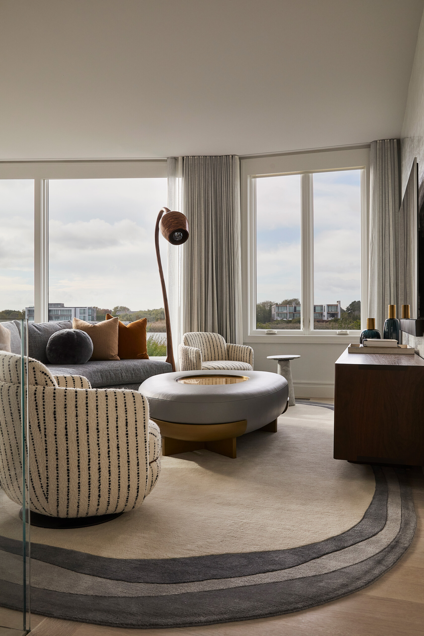 Hamptons Interior Design by Pembrooke & Ives. Textured neutral living room with sitting area and...