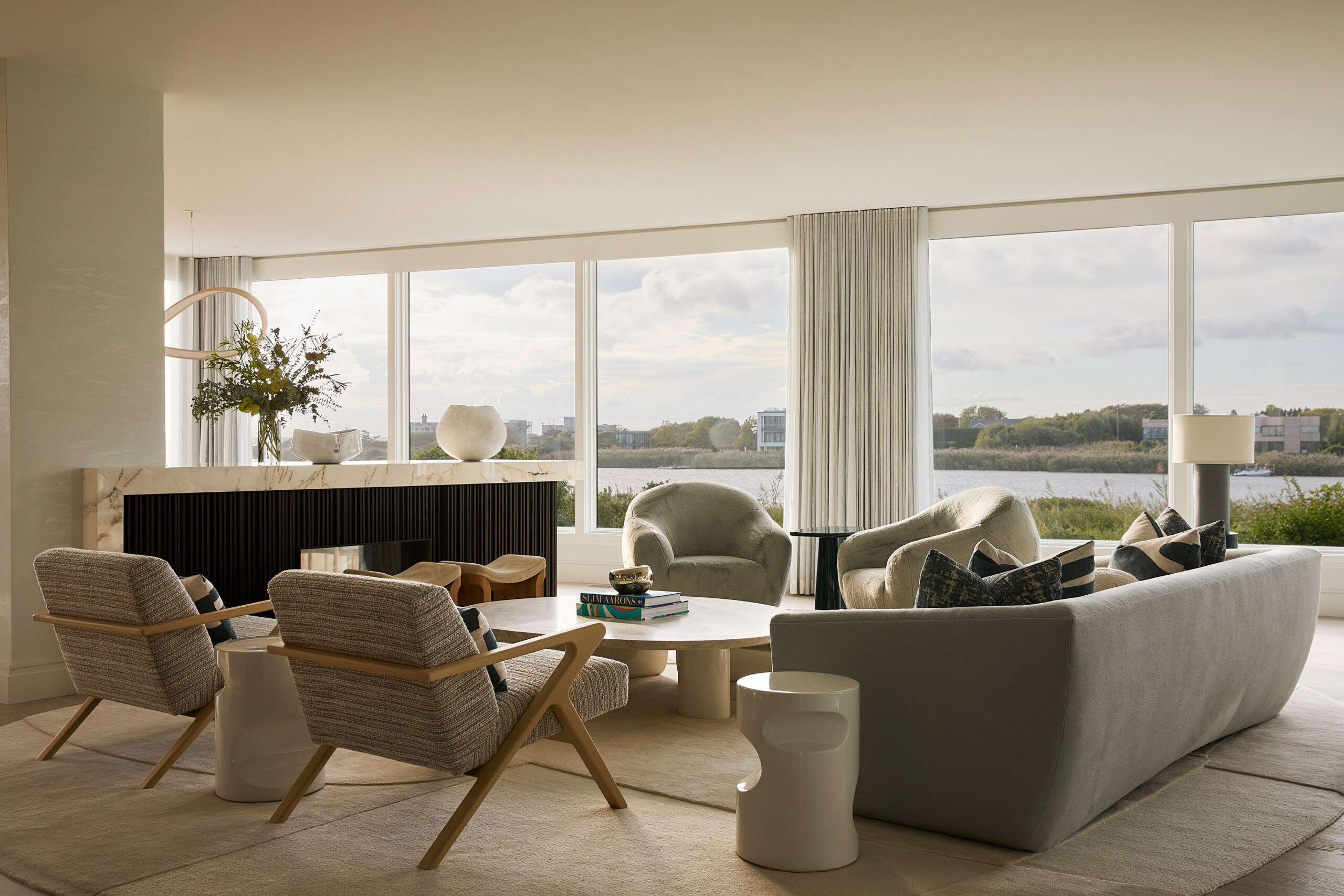 Hamptons Interior Design by Pembrooke & Ives. Textured neutral living room with sitting area.