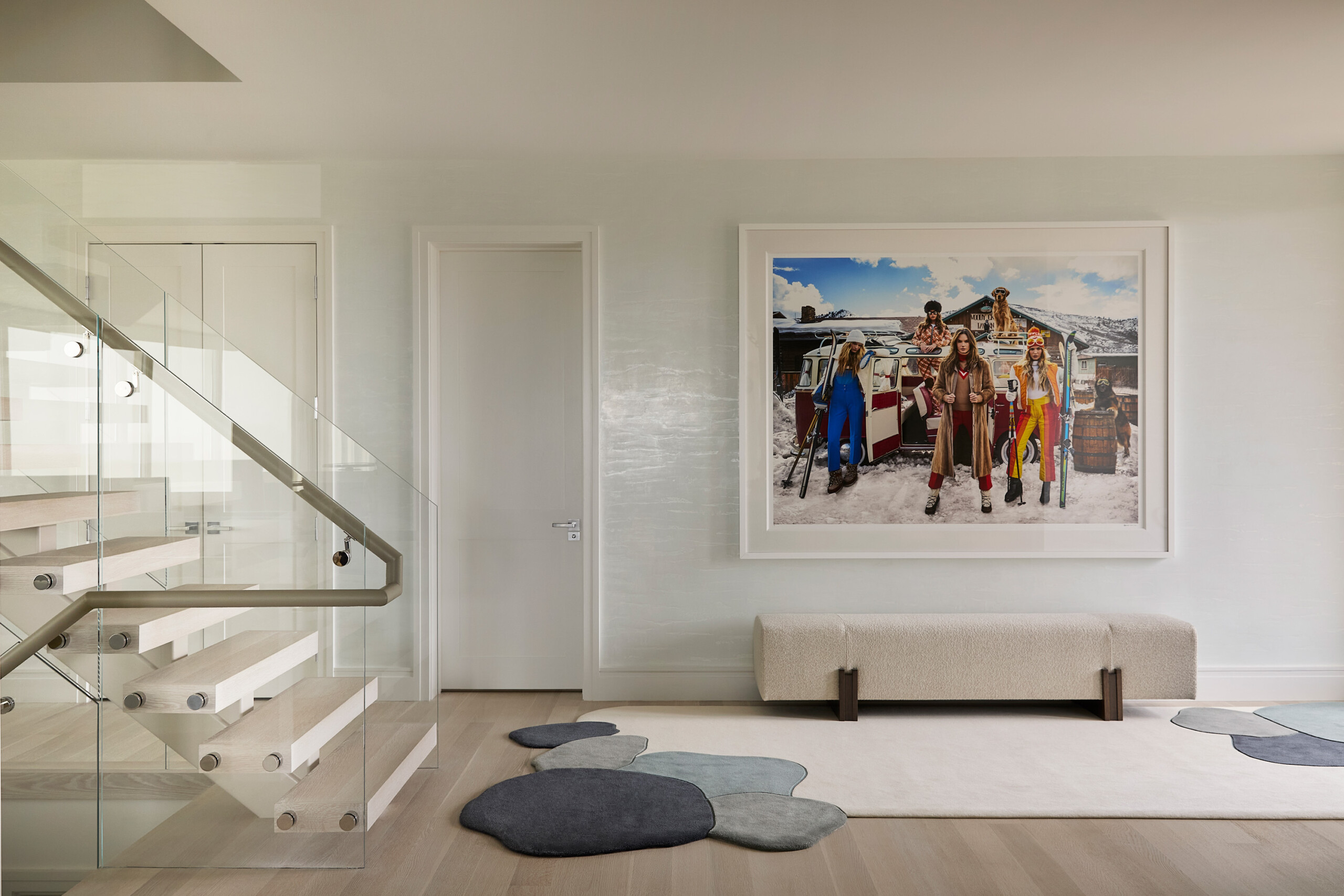 Hamptons Interior Design by Pembrooke & Ives. Modern entryway with neutral palette, plaster wall...