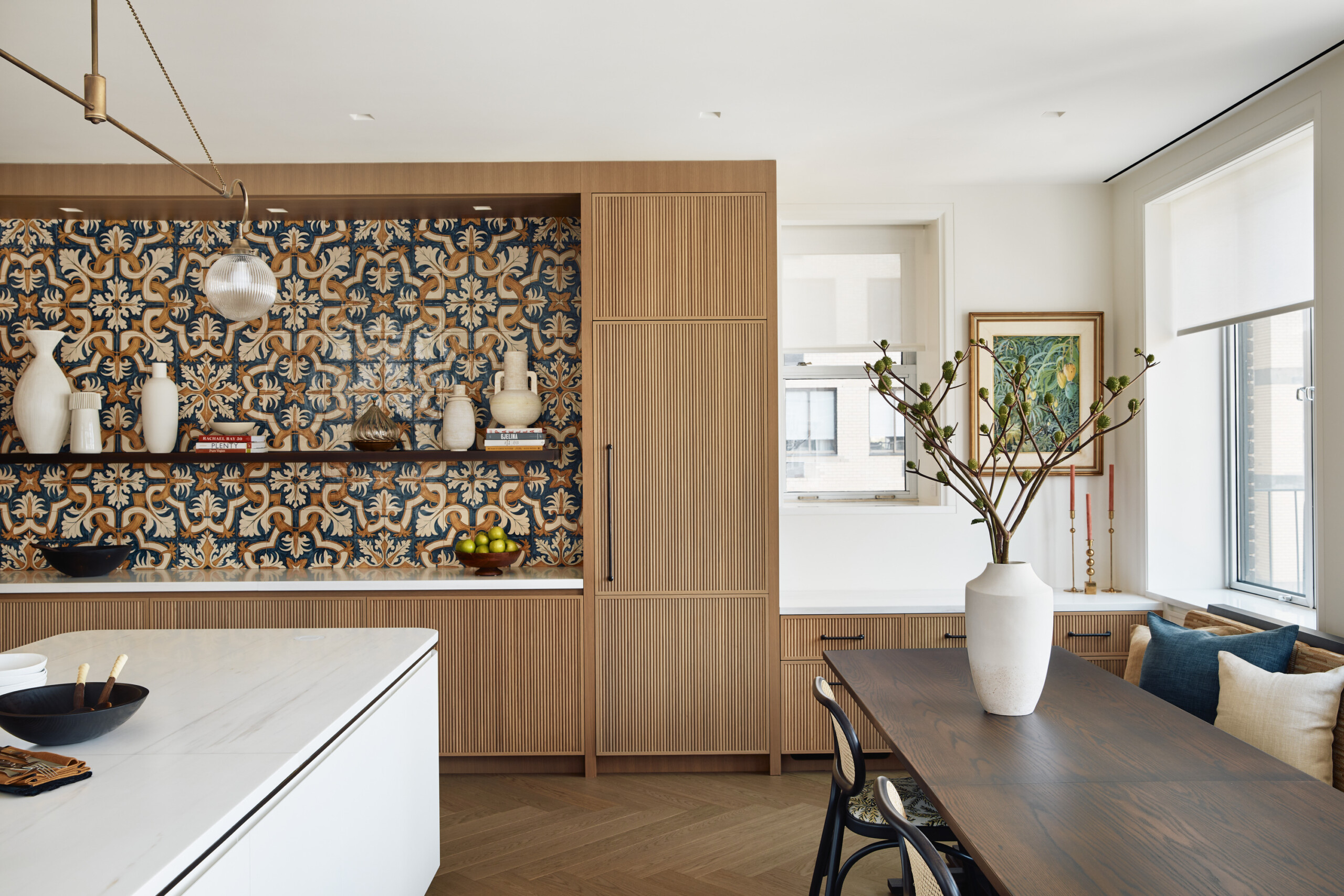 New York City interior design by Pembrooke & Ives. Kitchen with handmade tiles and white central...