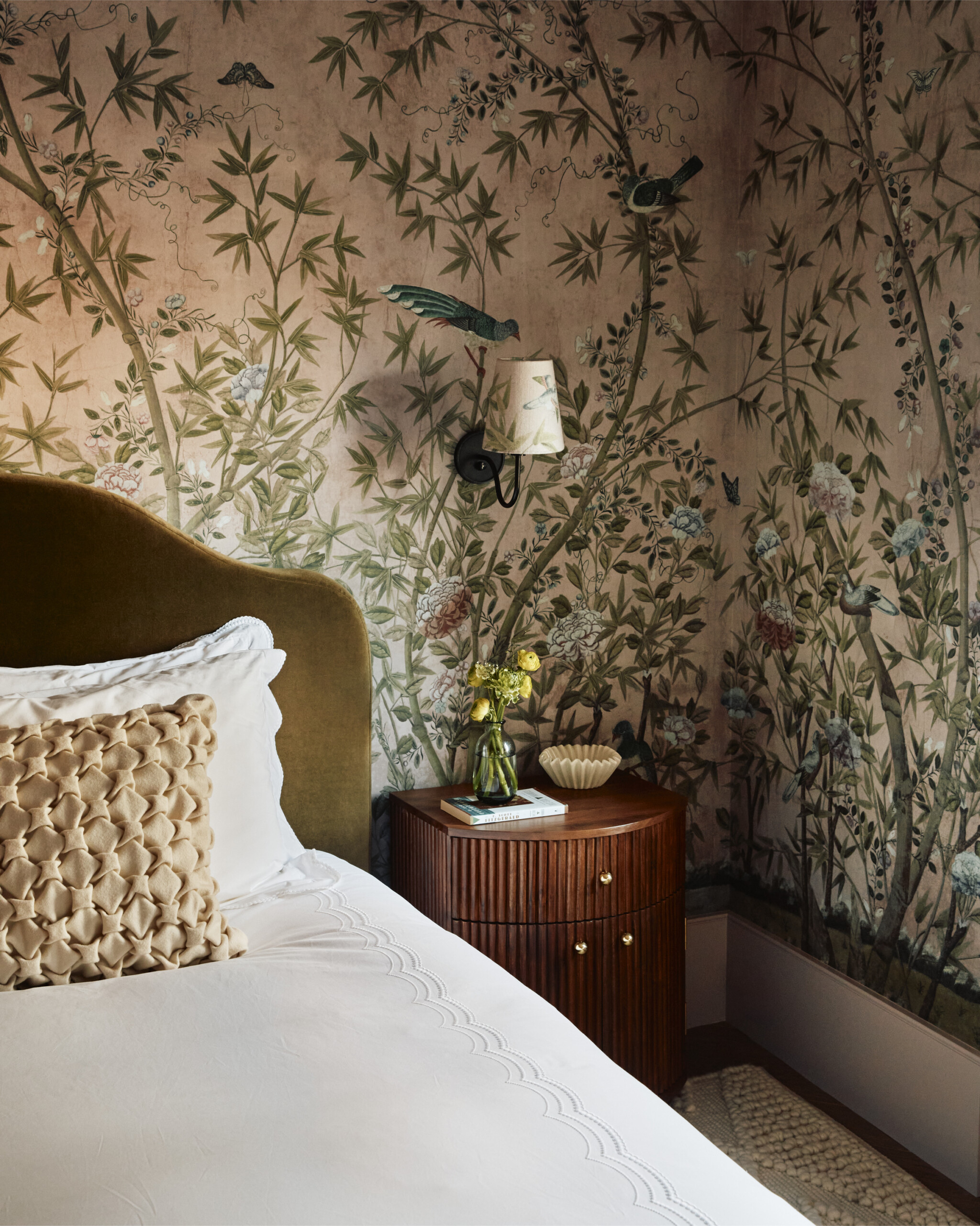 New York City interior design by Pembrooke & Ives. Bedroom with pink chinoiserie, green velvet...