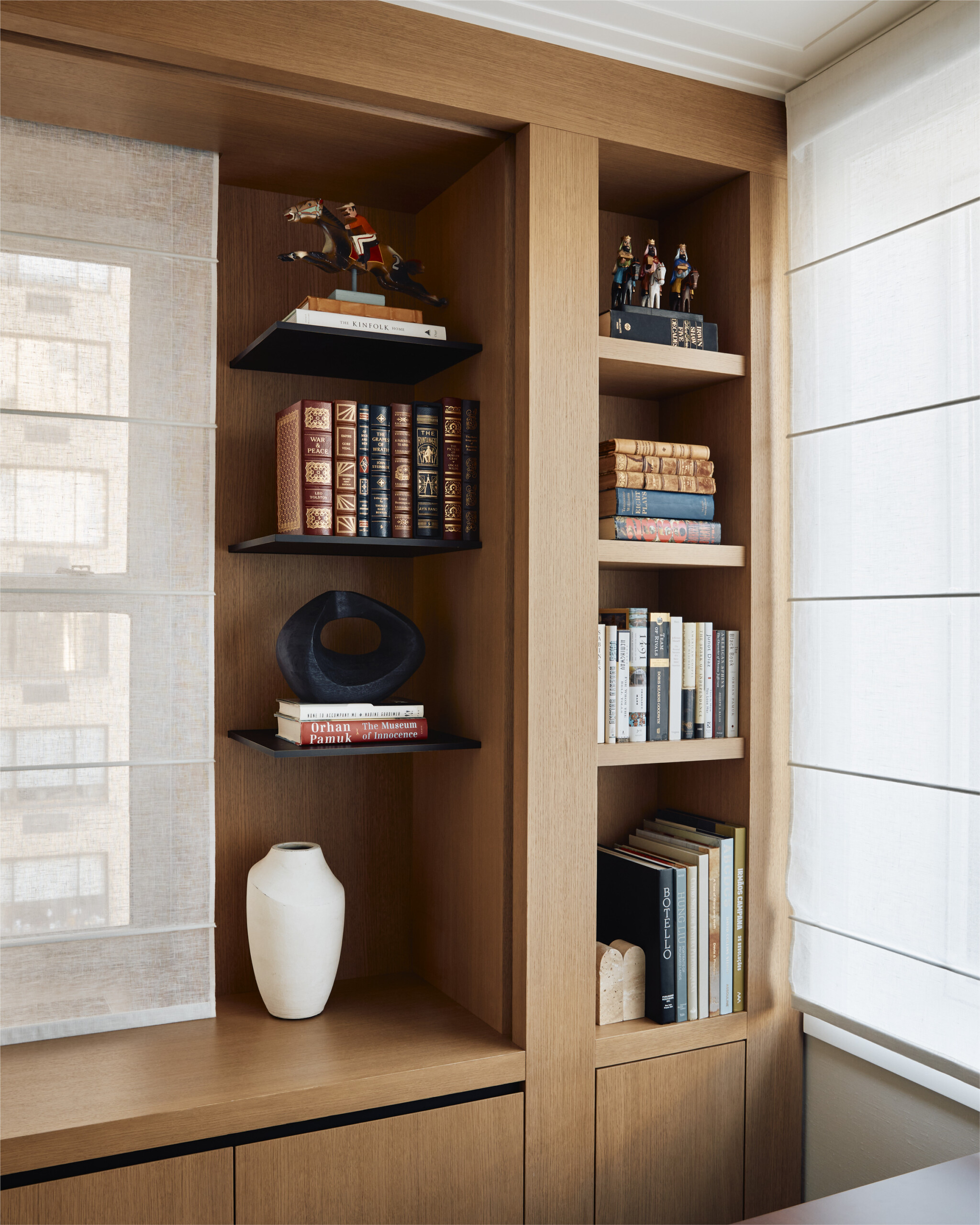 New York City interior design by Pembrooke & Ives. Home office with built-in shelving and book...