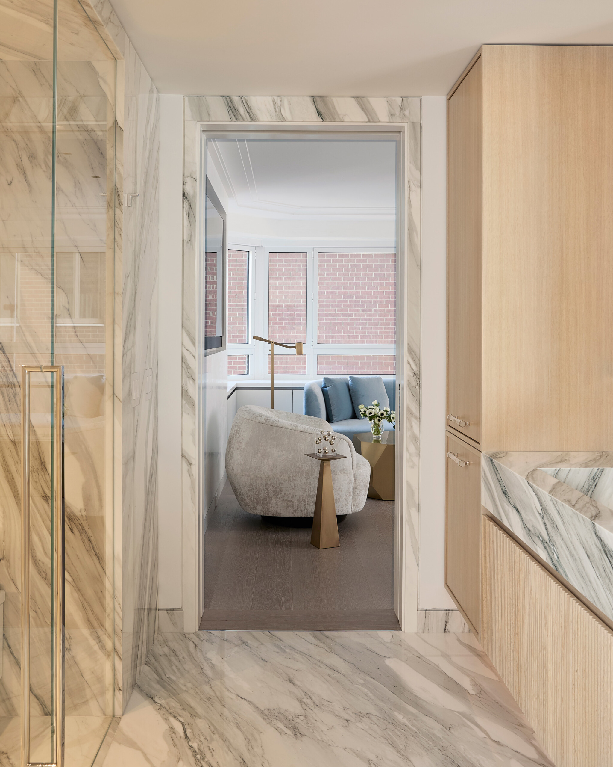 New York City Interior Design by Pembrooke & Ives. Primary bathroom with white oak cabinetry with...