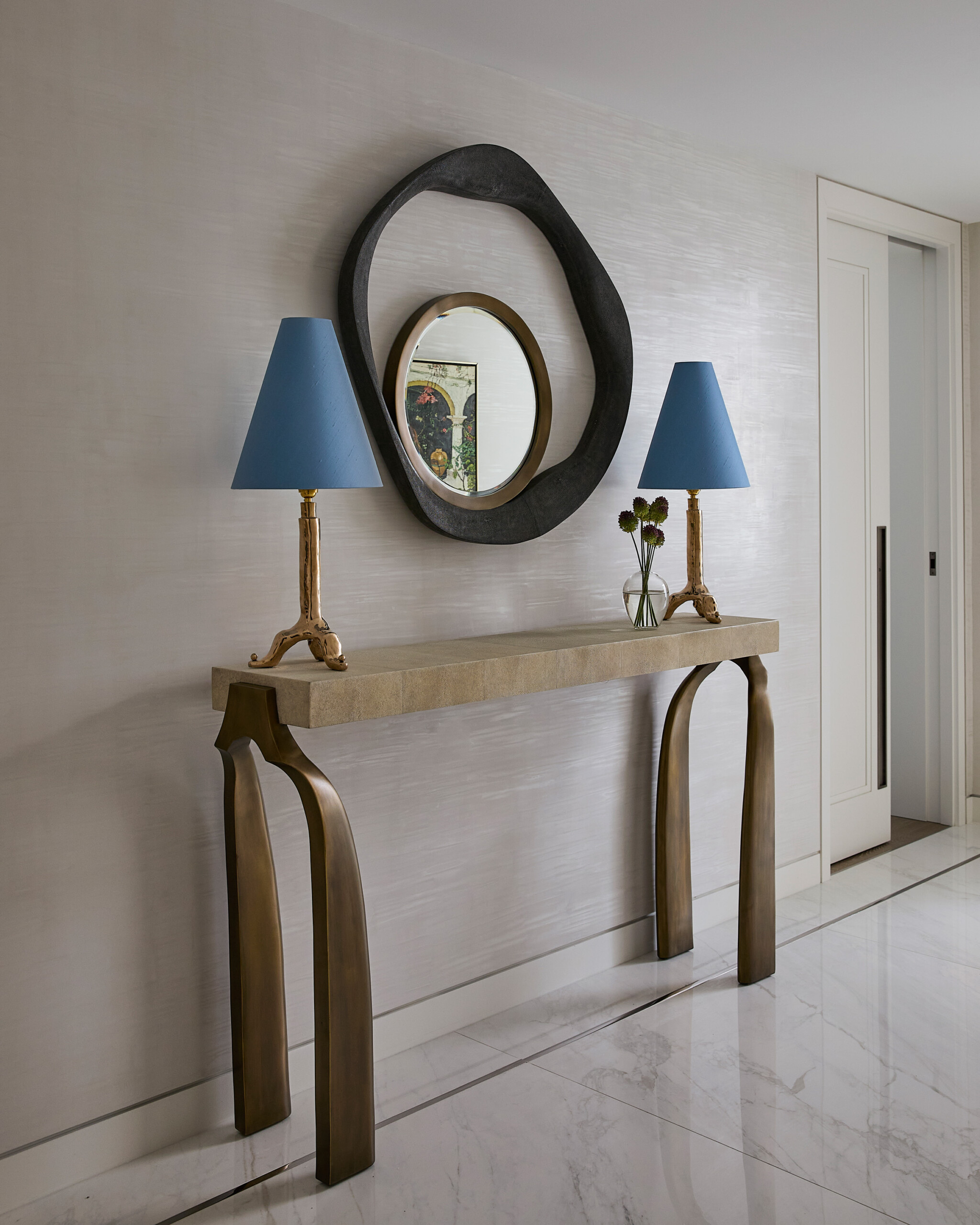 New York City Interior Design by Pembrooke & Ives. Hallway accent table with mirror and blue table...