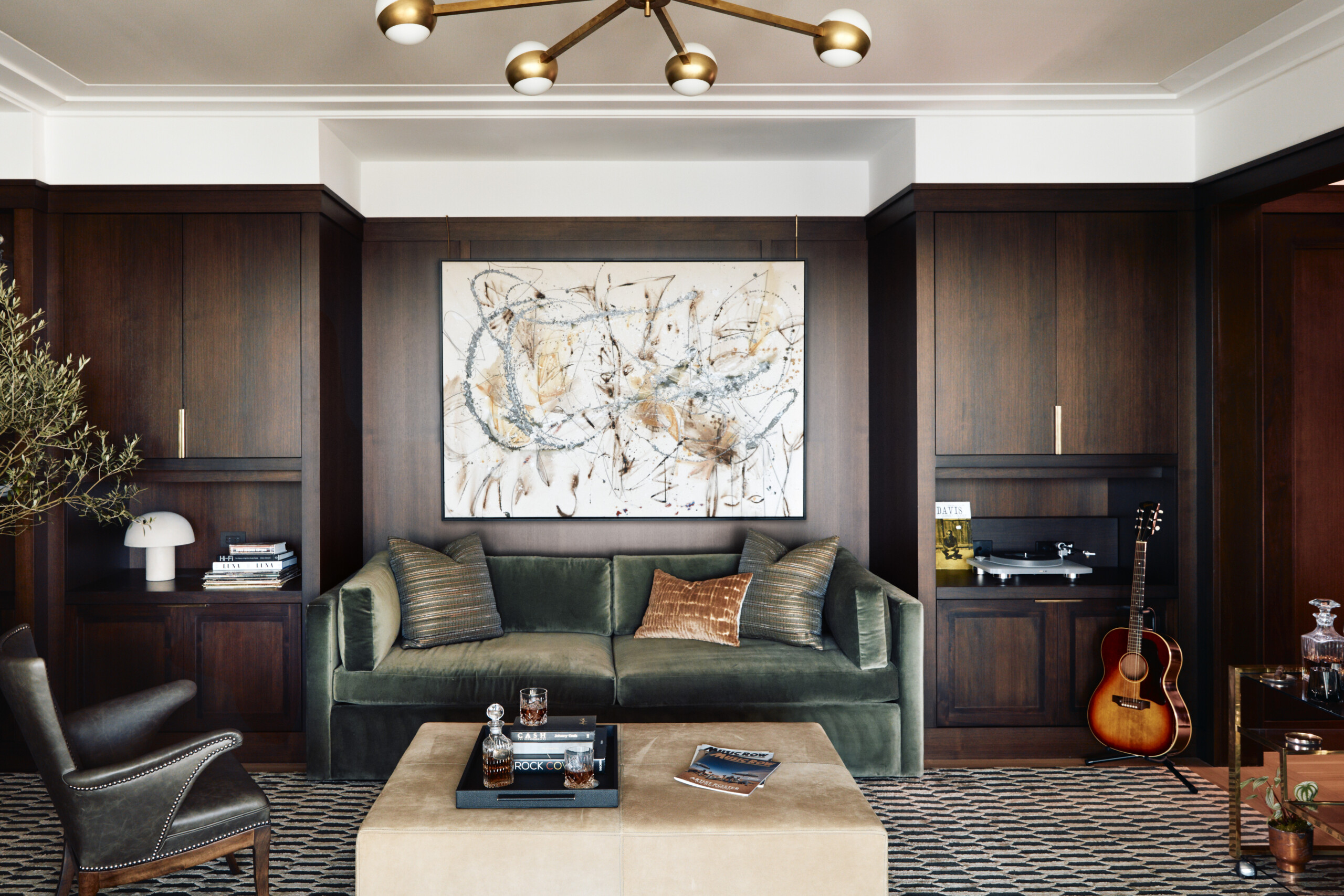 The Music Row Duplex office doubles as a lounge and listening room. Custom millwork lines the walls...