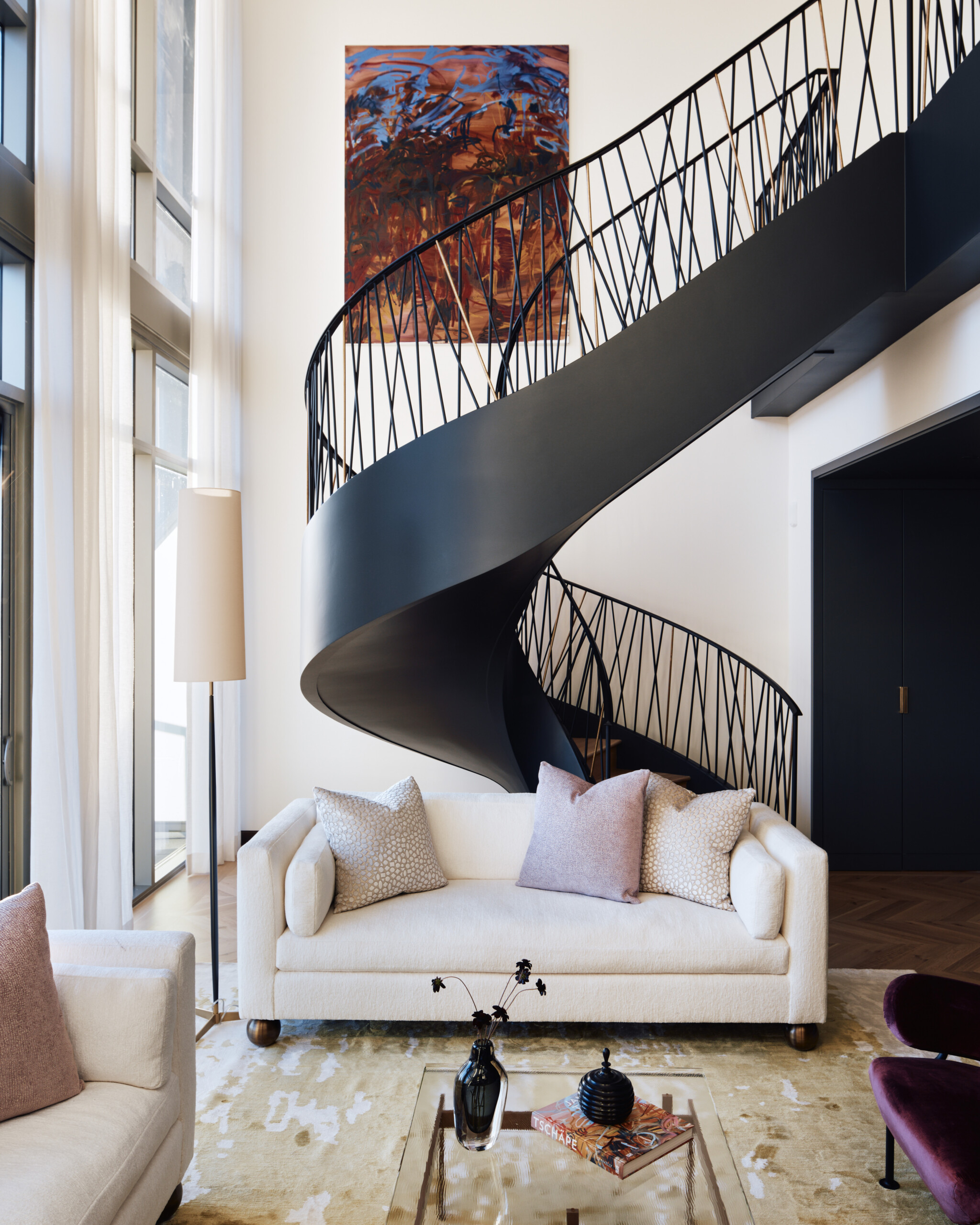 The Music Row Duplex features a custom spiral staircase, contemporary furnishings in a variety...
